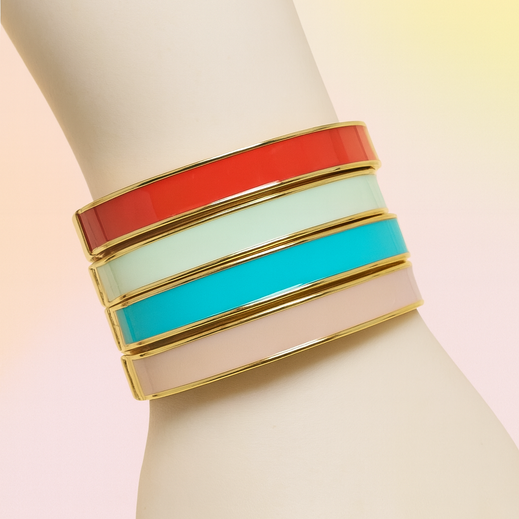 Colorful bracelet with gold accents on a mannequin arm against a light background