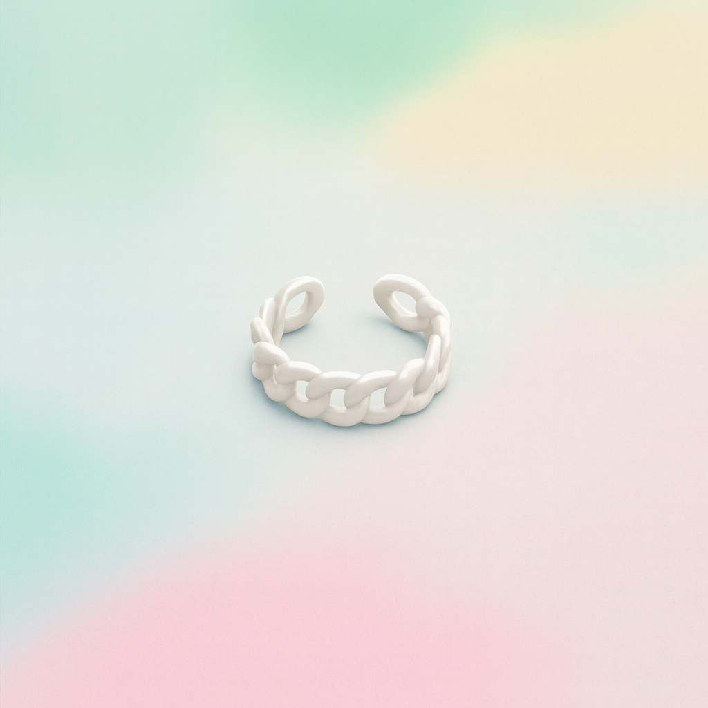 Silver ring on a pastel gradient background