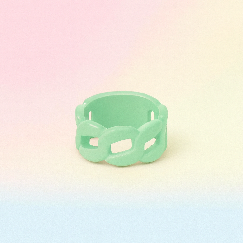 Green ring with a chain design on a pastel gradient background
