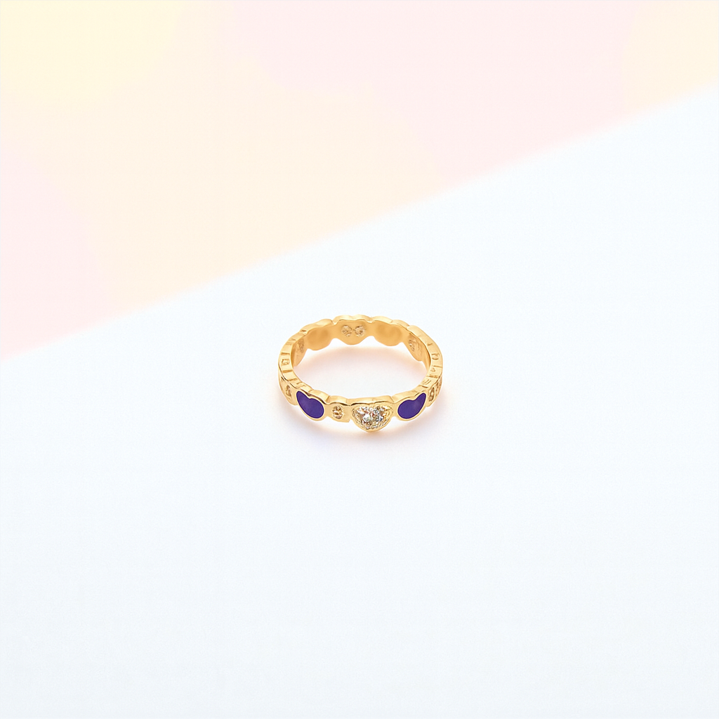 Gold ring with purple stones on a gradient background