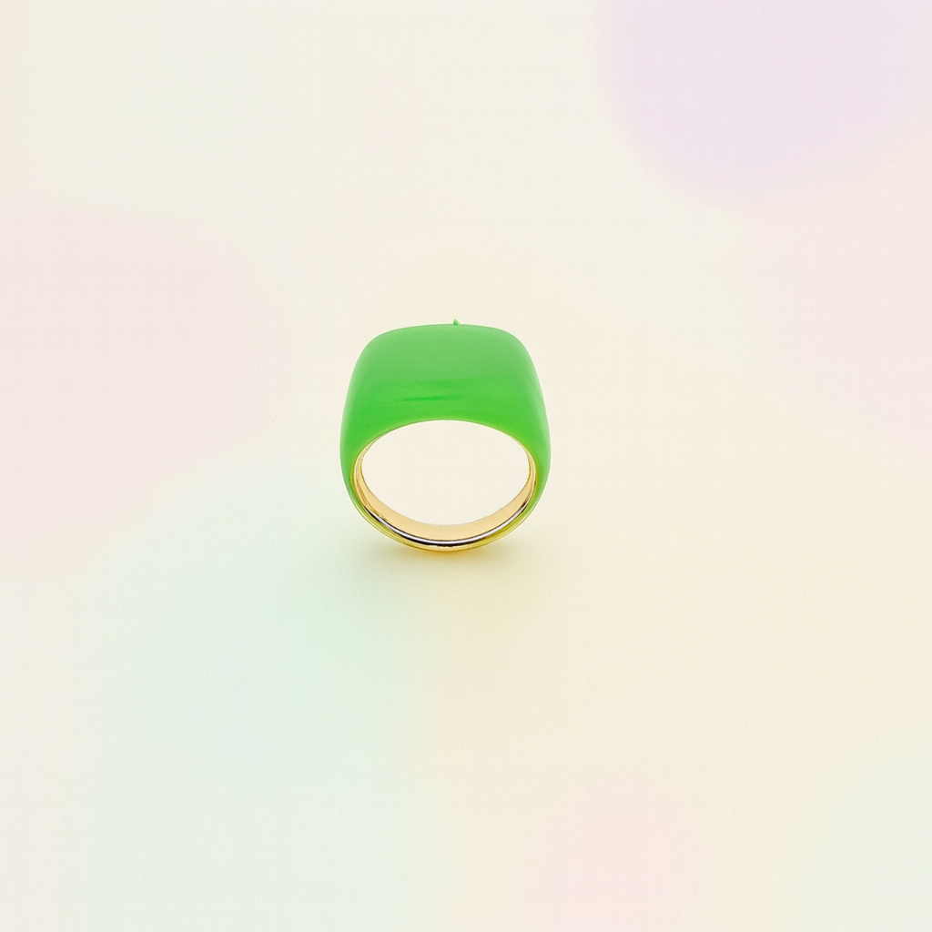 Green ring with gold band on a gradient background