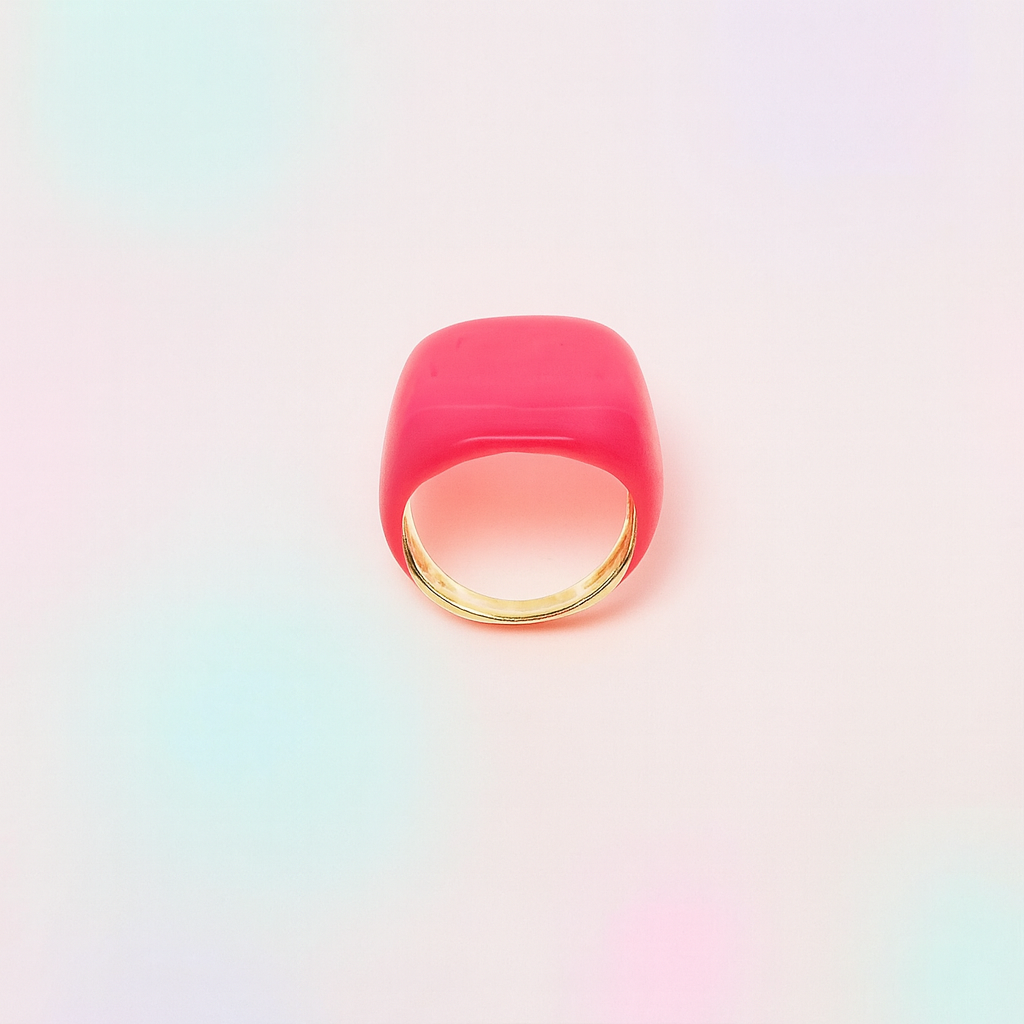 Pink ring with gold band on a gradient background