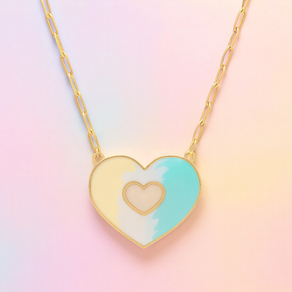 Heart-shaped necklace with a gold heart in the center on a pastel gradient background