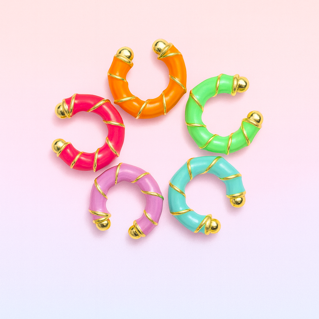 Colorful hoop earrings on a gradient pink and blue background