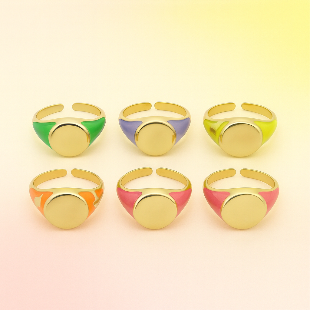 Six colorful rings with gold centers on a light yellow background