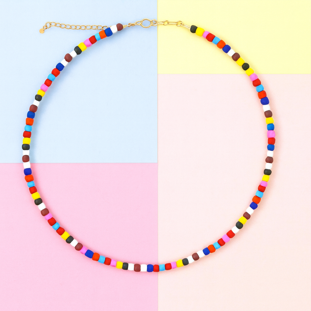 Colorful beaded necklace on a multicolored background