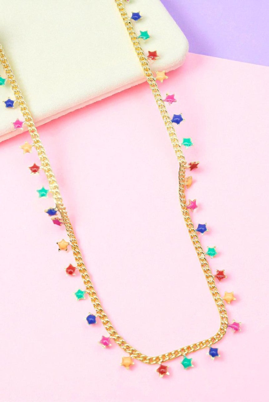 Necklace with colorful star-shaped beads on a pastel background
